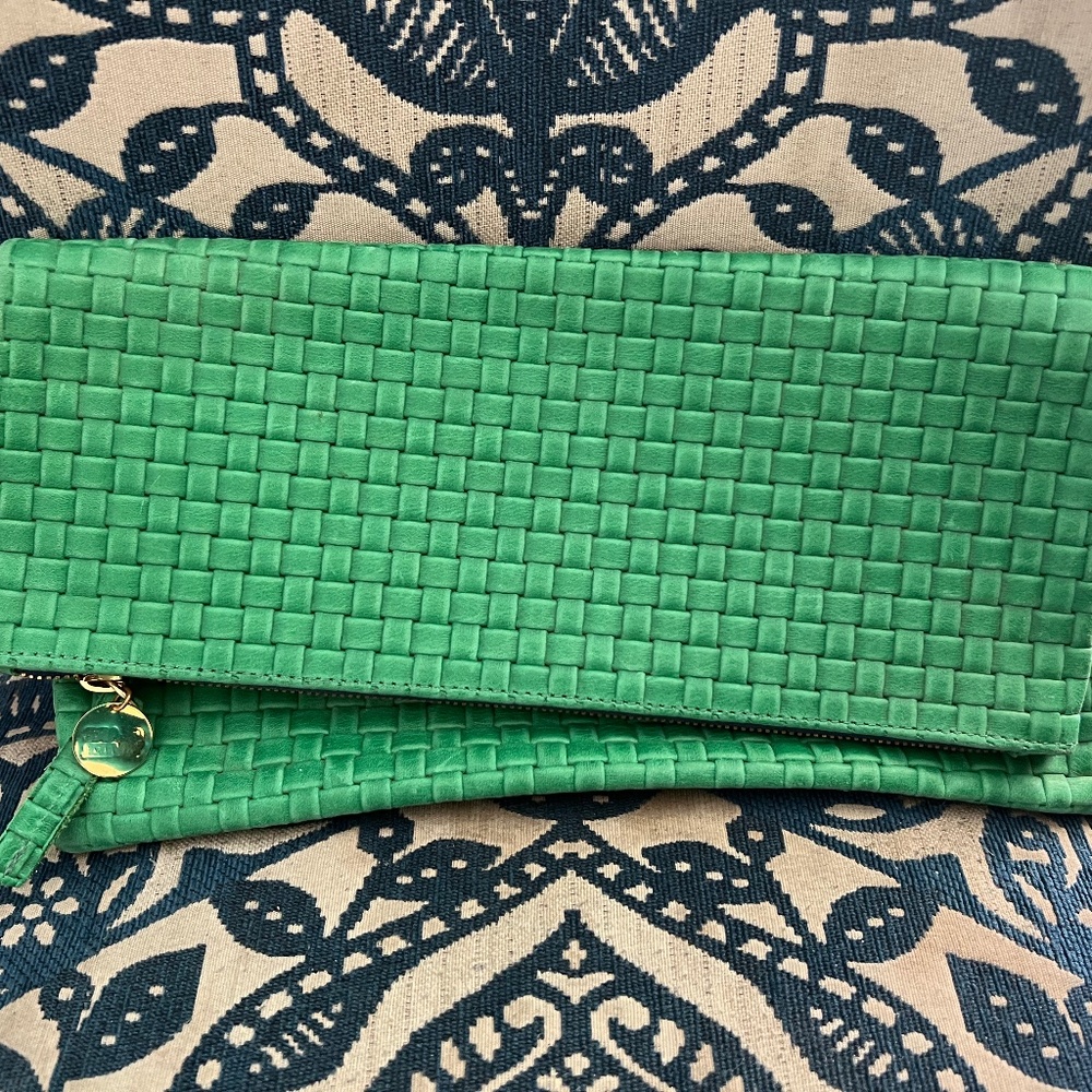 Green fold over leather clutch